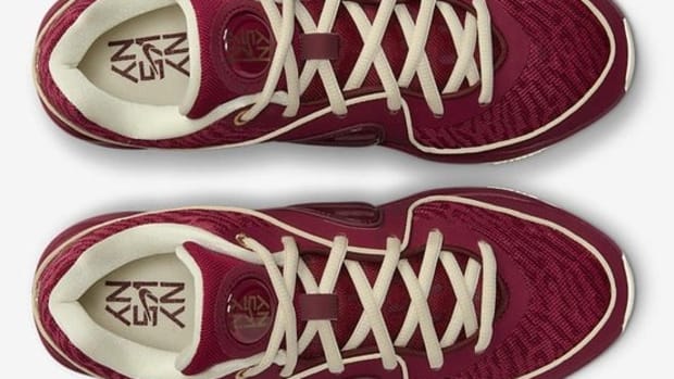 View of Kevin Durant's red and gold basketball shoes.
